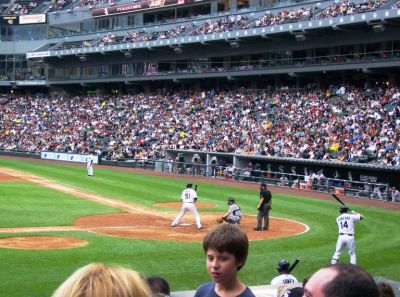 At White Sox game against Cleveland with seats behind dugout
