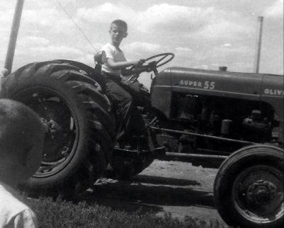 John on tractor on farm
