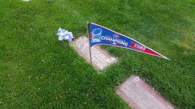 Moms Grave with Cubs World Series pennant
